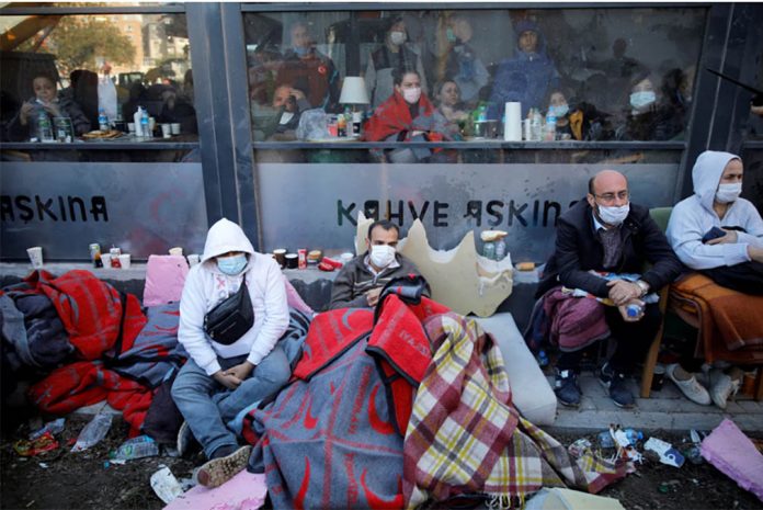 People watch rescue operations after an earthquake struck the Aegean Sea, in Izmir, Turkey on Oct. 31, 2020. KEMAL ASLAN/REUTERS