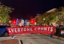 Activists march along State Street in front of the Pennsylvania State Capitol Building to protest attempts to halt the counting of ballots cast in the state for the 2020 presidential election. NATHAN LAYNE/REUTERS