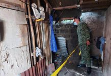 17-year-old lad shot to death A police officer inspects this house where a 17-year-old lad was shot to death in Barangay Villamonte, Bacolod City on Nov. 30. BCPO