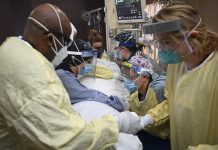 Biden vows 100M shots for US in first 100 days Critical care nurses and respiratory therapists flip a patient with COVID-19 upright at North Memorial Health Hospital in Robbinsdale, Minnesota. AARON LAVINSKY/STAR TRIBUNE VIA AP