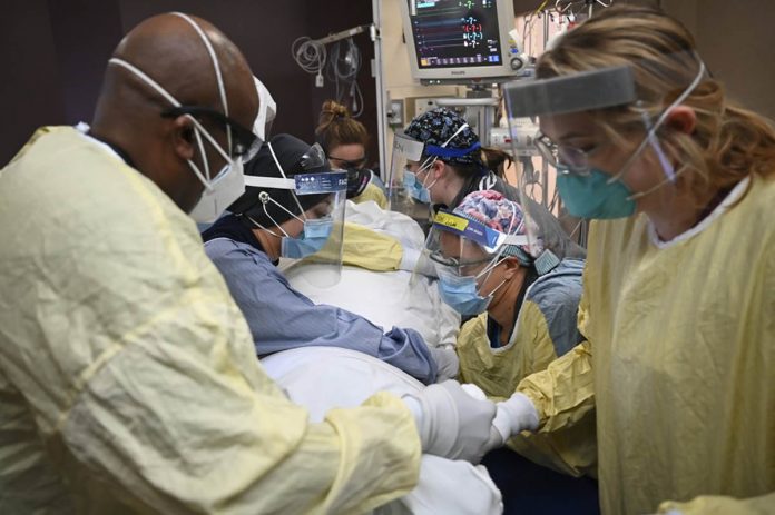 Critical care nurses and respiratory therapists flip a patient with COVID-19 upright at North Memorial Health Hospital in Robbinsdale, Minnesota. AARON LAVINSKY/STAR TRIBUNE VIA AP Critical care nurses and respiratory therapists flip a patient with COVID-19 upright at North Memorial Health Hospital in Robbinsdale, Minnesota. AARON LAVINSKY/STAR TRIBUNE VIA AP
