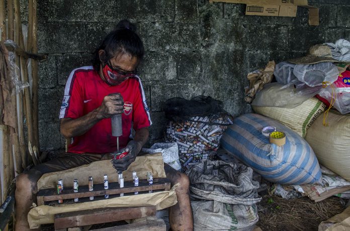 crackers This firecracker worker is busy finishing a batch of skyrockets in a makeshift factory. Setting off firecrackers during the holiday season, especially when welcoming the New Year, is an age-old Filipino tradition. IAN PAUL CORDERO/PN