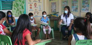 Wearing facemasks, these students gather around their teacher during counseling in this photo from the Department of Education. Starting Jan. 11 next year, authorities will be allowing face-to-face classes in select schools nationwide. DEPED