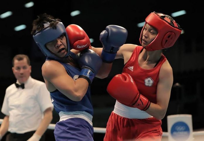 Ilongga boxer Irish Magno gets a punch from Indian Mary Kom during their quarterfinals match in the Asia Oceania Olympic Qualifying Tournament in Amman, Jordan last March. Magno is one of the four Filipino athletes competing in the 2020 Tokyo Olympics. JORDAN OLYMPIC COMMITTEE Ilongga boxer Irish Magno gets a punch from Indian Mary Kom during their quarterfinals match in the Asia Oceania Olympic Qualifying Tournament in Amman, Jordan last March. Magno is one of the four Filipino athletes competing in the 2020 Tokyo Olympics. JORDAN OLYMPIC COMMITTEE