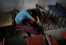 Pandemic threatens India’s children with child labor rising A bonded child laborer rests on a school desk in a safe house after being rescued during a raid by workers from Save Childhood Movement at a garments factory in New Delhi, India. KEVIN FRAYER /AP PHOTO