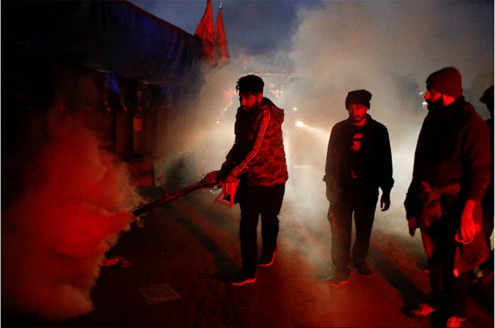 A man fumigates at a site at the Singhu border near New Delhi, India on Dec. 9, 2020. ADNAN ABIDI/REUTERS