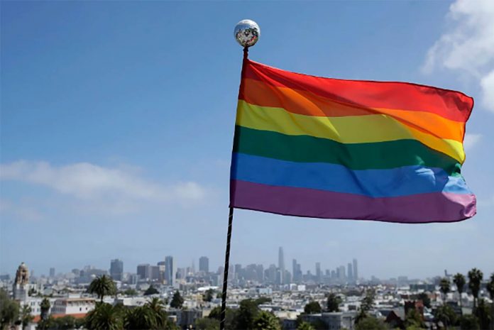 more than A rainbow flag flies over the skyline at Dolores Park in San Francisco on June 28, 2020. JEFF CHIU, AP/FILE