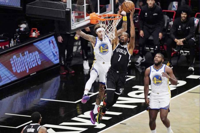 Brooklyn Nets forward Kevin Durant shoots as Golden State Warriors forward Kelly Oubre Jr. defends during the first quarter of an opening night NBA basketball game on Tuesday in New York, United States. PHOTO COURTESY OF KATHY WILLENS/AP Brooklyn Nets forward Kevin Durant shoots as Golden State Warriors forward Kelly Oubre Jr. defends during the first quarter of an opening night NBA basketball game on Tuesday in New York, United States. PHOTO COURTESY OF KATHY WILLENS/AP