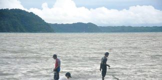 This portion of the breakwater of Fort San Pedro in Iloilo City is the perfect spot for fishing, according to these men. From a distance could be seen the island province of Guimaras. PN PHOTO