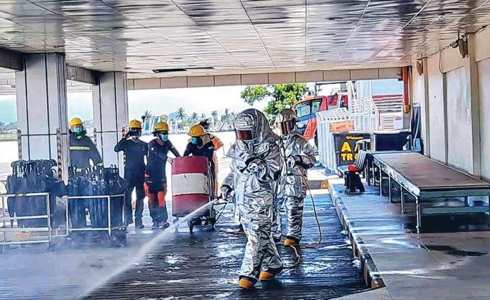 The Kalibo International Airport undertakes disinfection after every flight. Personnel also clean airport areas twice a day. PHOTO KALIBO ARFF