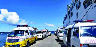 Following the surge in new coronavirus disease cases in Barangay Poblacion, Kalibo, Aklan, the local government unit is limit the number of residents returning home from other areas this holiday season. Photo shows ambulances ready to fetch returning locally stranded individuals and overseas Filipino workers.