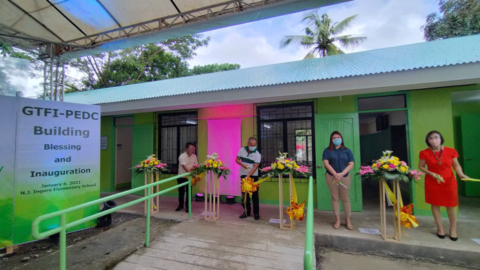 Panay Power Corp. assistant vice president and plant manager Engr. Aprudencio Espanta (second from left) leads the inauguration of GFTI-PEDC building at N.J. Ingore Elementary School in Barangay Ingore, La Paz, Iloilo City on Jan. 6, 2020. IAN PAUL CORDERO/PN
