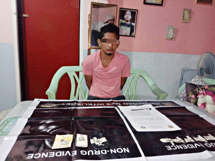 BUSTED. Abnell Suanque yielded these suspected shabu and marked money during an entrapment operation in in Barangay 1 Poblacion, Hinigaran, Negros Occidental on Jan. 27. RADIO NATIN HINIGARAN BUSTED. Abnell Suanque yielded these suspected shabu and marked money during an entrapment operation in in Barangay 1 Poblacion, Hinigaran, Negros Occidental on Jan. 27. RADIO NATIN HINIGARAN