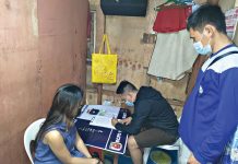 Woman jailed over ‘drugs’ Drug suspect Baby Girl Villarna sits handcuffed while antidrug operatives conduct an inventory of suspected shabu seized in a buy-bust operation in Barangay 2 on Jan. 28. BCPO