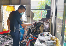 Fire razes Arevalo house An arson investigator inspects the living room of a fire-hit house owned by the Majometano family in Barangay Sooc, Arevalo, Iloilo city on Jan. 5. IAN PAUL CORDERO/PN