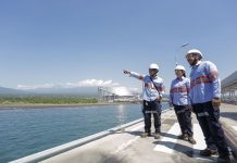BEYOND THE HORIZON. Engineers at the baseload facility operated by AboitizPower subsidiary Therma South, Inc. (TSI) in Davao City look toward the horizon, an act symbolic of the AboitizPower Group’s forward-looking mindset in 2021.