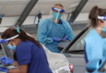 Australia moves coronavirus vaccine rollout to early March Medical workers administer tests at the Bondi Beach drive-through COVID-19 testing center in the wake of an outbreak in Sydney, Australia on Dec. 22, 2020. LOREN ELLIOTT/REUTERS
