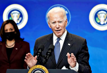 Biden open to negotiate $1,400 COVID stimulus checks President Joe Biden speaks about administration plans to strengthen American manufacturing as Vice President Kamala Harris listens in the South Court Auditorium at the White House in Washington, U.S., January 25, 2021. REUTERS/Kevin Lamarque