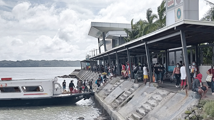 People from Guimaras disembark from this motorboat at the Iloilo Ferry Terminal-Parola in Iloilo City. Note the many people waiting at the terminal; they will be boarding the motorboat which would leave after 15 minutes back to Guimaras. IAN PAUL CORDERO/ PN People from Guimaras disembark from this motorboat at the Iloilo Ferry Terminal-Parola in Iloilo City. Note the many people waiting at the terminal; they will be boarding the motorboat which would leave after 15 minutes back to Guimaras. IAN PAUL CORDERO/ PN