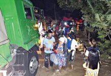 WET START FOR 2021. Police officers assist residents seeking evacuation after flashfloods hit 12 villages in Victorias City, Negros Occidental on New Year’s Eve. Thousands were forced to flee their inundated homes as torrential rain triggered floods in some parts of the province. CONTRIBUTED PHOTO