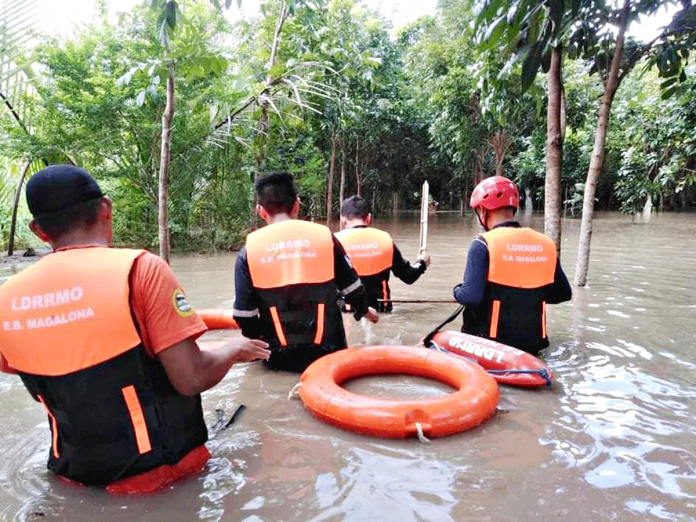 E.B. MAGALONA DRRMO Personnel of the Disaster Risk Reduction and Management Council of E.B. Magalona, Negros Occidental conduct rescue efforts during the Jan. 9 flooding. Thirteen of the town’s 23 villages were submerged to flood waters brought by heavy rains. Mayor Marvin Malacon placed E.B. Magalona under state of calamity. E.B. MAGALONA DRRMO Personnel of the Disaster Risk Reduction and Management Council of E.B. Magalona, Negros Occidental conduct rescue efforts during the Jan. 9 flooding. Thirteen of the town’s 23 villages were submerged to flood waters brought by heavy rains. Mayor Marvin Malacon placed E.B. Magalona under state of calamity.