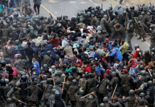 US-bound migrant caravan beaten back in Guatemala Police and troops used sticks to beat them back. REUTERS