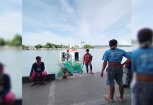 The crew of this Guimaras-bound modernized motorboat docked at the Iloilo Ferry Terminal-Parola in Iloilo City wait for passengers. IAN PAUL CORDERO/PN