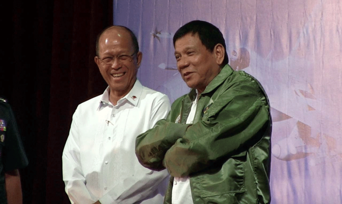 lorenzana Department of National Defense (DND) secretary Delfin Lorenza (left) stands alongside President Rodrigo Duterte. The country’s defense minister assured students of the University of the Philippines (UP) that there will be no abuse coming from state forces days after the abrogation of the UP-DND accord. FRANZ LOPEZ/RAPPLER