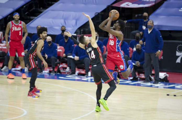 Philadelphia 76ers’ Shake Milton attempts a three-pointer over the defense of Miami Heat’s Tyler Herro. FANSIDED PHOTO Philadelphia 76ers’ Shake Milton attempts a three-pointer over the defense of Miami Heat’s Tyler Herro. FANSIDED PHOTO