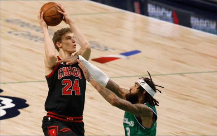 Chicago Bulls forward Lauri Markkanen shoots over Dallas Mavericks center Willie Cauley-Stein during the first half of an NBA basketball game on Jan. 17, 2021. RON JENKINS/AP PHOTO Chicago Bulls forward Lauri Markkanen shoots over Dallas Mavericks center Willie Cauley-Stein during the first half of an NBA basketball game on Jan. 17, 2021. RON JENKINS/AP PHOTO