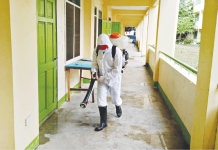 Bacolod City eyes schools as COVID vaccination centers DISINFECTION. As a precaution against the spread of coronavirus, this worker wearing hazmat suit disinfects rooms of a public elementary school converted into a quarantine facility in Bacolod City. Local authorities will utilize classrooms in public schools as vaccination centers. BACOLOD DRRMO
