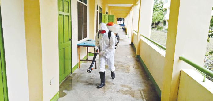 DISINFECTION. As a precaution against the spread of coronavirus, this worker wearing hazmat suit disinfects rooms of a public elementary school converted into a quarantine facility in Bacolod City. Local authorities will utilize classrooms in public schools as vaccination centers. BACOLOD DRRMO DISINFECTION. As a precaution against the spread of coronavirus, this worker wearing hazmat suit disinfects rooms of a public elementary school converted into a quarantine facility in Bacolod City. Local authorities will utilize classrooms in public schools as vaccination centers. BACOLOD DRRMO