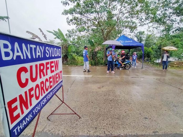 passi-checkpoint Personnel of the Passi City government man a curfew checkpoint on Friday. Due to surge of coronavirus infections, Passi reverted to enhanced community quarantine for two weeks. CURFEW CHECKPOINT