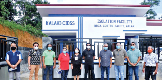 Officials of the Department of Social Welfare and Development Region 6 and the municipality of Balete, Aklan stand in front of a newly-inaugurated quarantine facility of the town. PHOTO DSWD 6