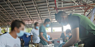Guimaras drug surrenderers submit urine samples for testing at the auditorium of Nueva Valencia, Guimaras. PDEA PHOTO