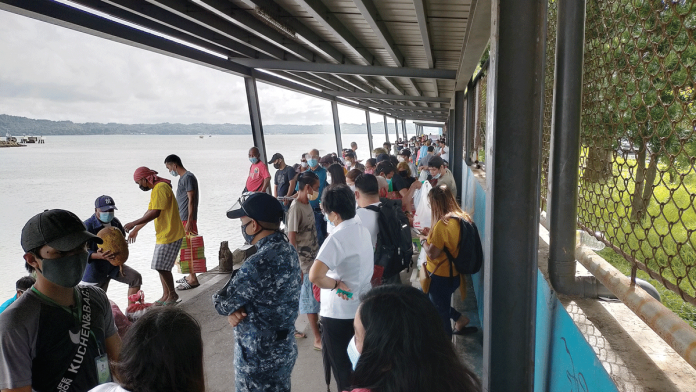 Guimaras-bound people wait at the Iloilo Ferry Terminal-Parola in Iloilo City for motorboats would that take them across the Iloilo Strait to the island province nearby. IAN PAUL CORDERO/PN Guimaras-bound people wait at the Iloilo Ferry Terminal-Parola in Iloilo City for motorboats would that take them across the Iloilo Strait to the island province nearby. IAN PAUL CORDERO/PN