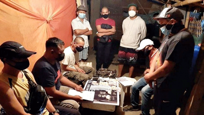Antidrug oepratives conduct an inventory of suspected shabu seized from Elmer Niquia in a buy-bust operation in Barangay Alalasan, La Paz, Iloilo City Thursday. IPPO Antidrug oepratives conduct an inventory of suspected shabu seized from Elmer Niquia in a buy-bust operation in Barangay Alalasan, La Paz, Iloilo City Thursday. IPPO