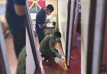 Alijis man shot to death inside house A scene of the crime operative and a police officer investigate the house of Joeffrey Parandas where he was shot to death by three unidentified assassins in Barangay Alijis, Bacolod City on Jan. 12. BCPO