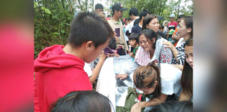LAID TO REST. Cries of grief punctuate the funeral ceremony of three slain tumandok members Sunday morning in Tapaz, Capiz. Their families and relatives bid an emotional farewell weeks after the fatal military-police operations. SANDUGO-MOVEMENT OF MORO AND INDIGENOUS PEOPLES