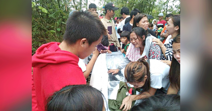 LAID TO REST. Cries of grief punctuate the funeral ceremony of three slain tumandok members Sunday morning in Tapaz, Capiz. Their families and relatives bid an emotional farewell weeks after the fatal military-police operations. SANDUGO-MOVEMENT OF MORO AND INDIGENOUS PEOPLES LAID TO REST. Cries of grief punctuate the funeral ceremony of three slain tumandok members Sunday morning in Tapaz, Capiz. Their families and relatives bid an emotional farewell weeks after the fatal military-police operations. SANDUGO-MOVEMENT OF MORO AND INDIGENOUS PEOPLES