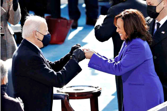 biden President-elect Joe Biden greets Vice President Kamala Harris during the inauguration of Joe Biden as the 46th President of the United States at the West Front of the U.S. Capitol in Washington, United States on Jan. 20, 2021. BRENDAN MCDERMID/REUTERS