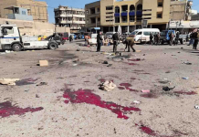 Twin suicide bombings rock central Baghdad, at least 28 dead Security forces work at the site of a deadly bomb attack in a market selling used clothes, Iraq on Jan. 21, 2021. AP PHOTO