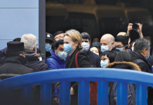 China fires back at US allegations The World Health Organization team is briefed outside the Huanan seafood market on the third day of their field visit in Wuhan, China. The market was initially suspected as the place where people first became infected with coronavirus disease 2019. AP PHOTO/NG HAN GUAN