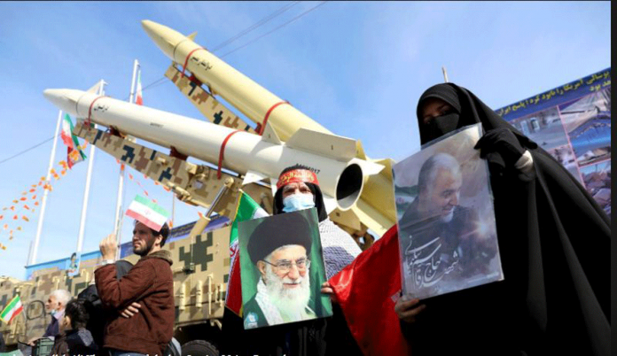 Women hold pictures of Iran’s supreme leader Ali Khamenei and late Iranian Major-General Qassem Soleimani during the 42nd anniversary of Islamic Revolution in Tehran, Iran on Feb. 10. MAJID ASGARIPOUR/ WEST ASIA NEWS AGENCY VIA REUTERS
