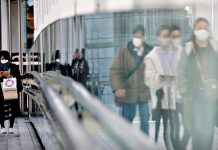 Japan finds new COVID-19 strain Pedestrians wearing protective masks walk on a street in Tokyo, Japan amid the coronavirus disease 2019 outbreak. .REUTERS/KIM KYUNG-HOON/FILE PHOTO