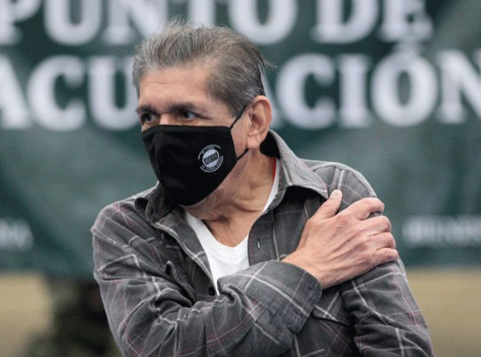 Mexico-to-rich-countries A man taps his shoulder to apply pressure on the injected site after receiving a dose of coronavirus disease 2019 vaccine in Linares, Mexico on Feb. 17, 2021. REUTERS/DANIEL BECERRIL