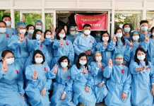 Medics in Yangon General Hospital wear red ribbons as a sign of protest. REUTERS