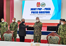Philippine National Police chief Gen. Debold Sinas (2nd from right) and Philippine Drug Enforcement Agency director general Wilkins Villanueva (3rd from left) do a fist bump during a joint press briefing in Camp Crame, Quezon City on Thursday. PNA PHOTO BY LLOYD CALIWAN