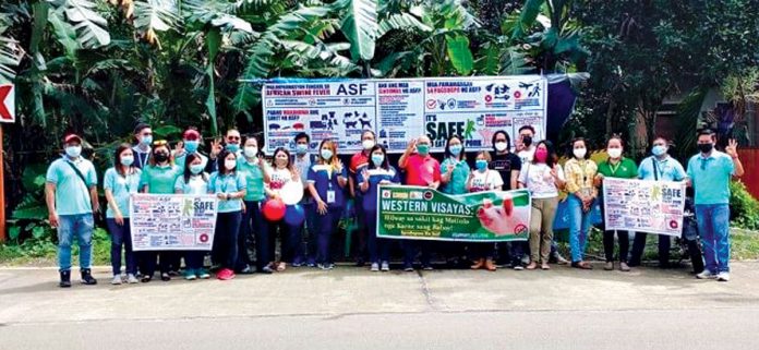 Private-groups_c Members of the Iloilo-Bacolod Association of Veterinary Sales Representatives pose for a group photo during the week-long caravan in Panay Island. SMHTORENO/DA-RFO VI/RAFIS
