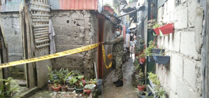 bac-pic A man died while his live-in partner was wounded in a shooting incident. An officer of Police Station 2 cordons the crime scene in Purok Sigay, Barangay 2, Bacolod City on Feb. 16. POLICE STATION 2/BCPO